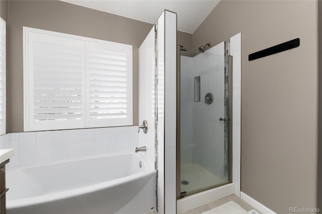 bathroom with vanity and independent shower and bath