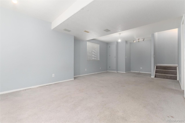 empty room featuring light colored carpet