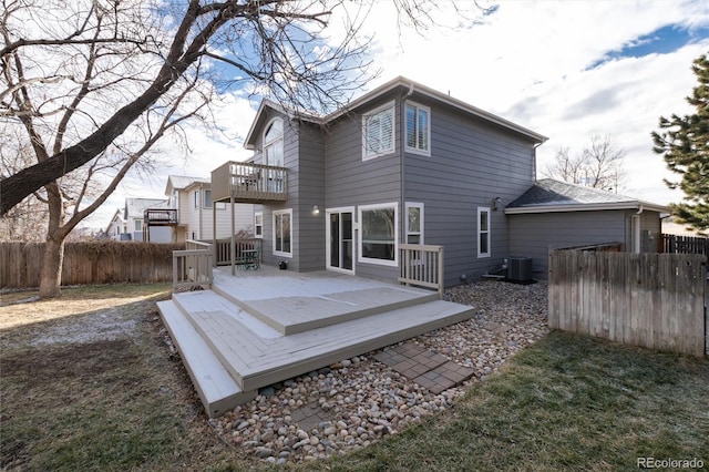 back of house featuring a deck and central air condition unit