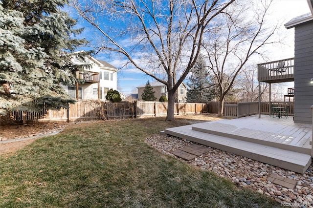 view of yard featuring a wooden deck