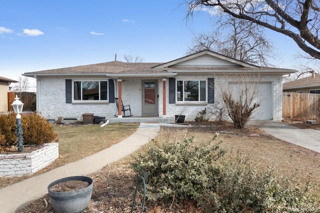 ranch-style house with a garage and a front lawn