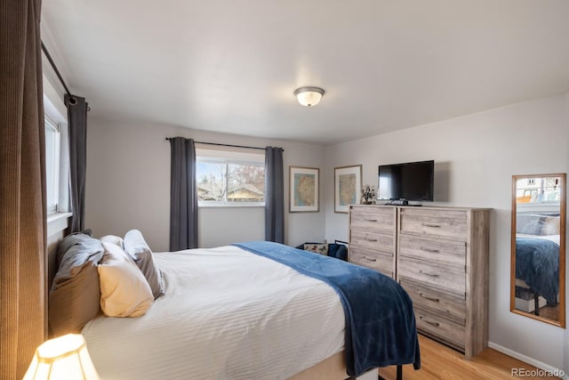 bedroom with light hardwood / wood-style flooring