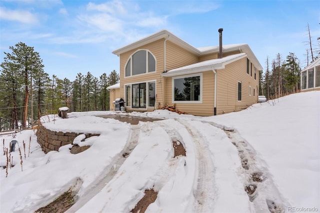 27987 Pine Grove Trl, Conifer, CO 80433 - view of snow covered rear of property