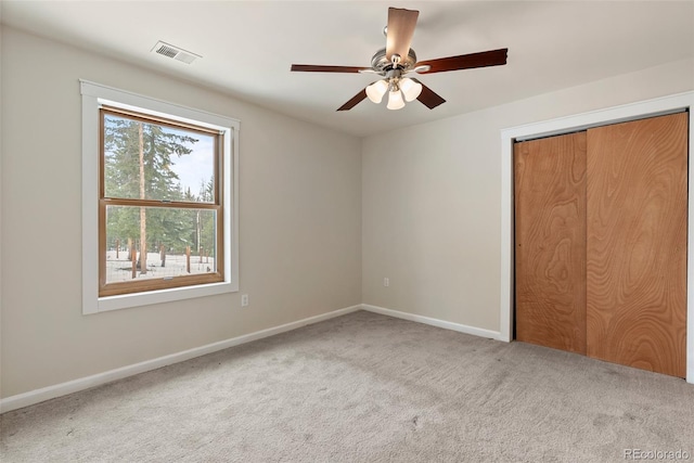 27987 Pine Grove Trl, Conifer, CO 80433 - unfurnished bedroom featuring carpet, baseboards, a closet, and a ceiling fan