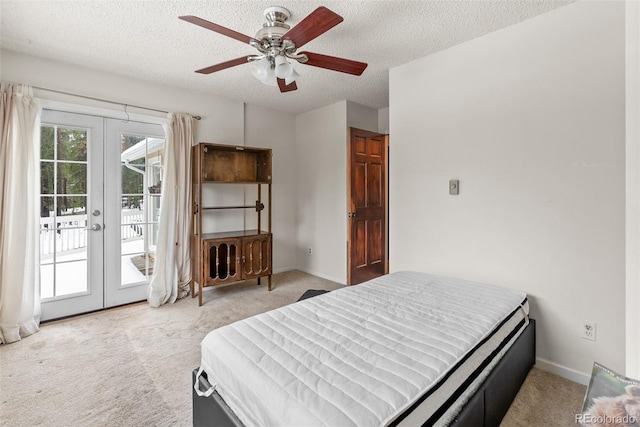 27987 Pine Grove Trl, Conifer, CO 80433 - bedroom featuring french doors, access to outside, light carpet, a textured ceiling, and ceiling fan