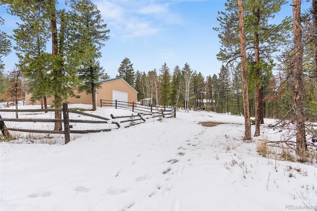 27987 Pine Grove Trl, Conifer, CO 80433 - yard covered in snow with a pole building and an outbuilding