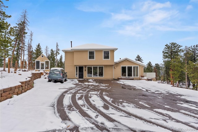 27987 Pine Grove Trl, Conifer, CO 80433 - view of snow covered rear of property