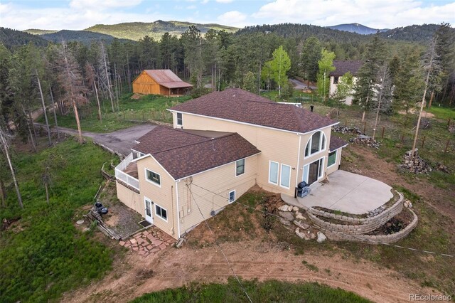 27987 Pine Grove Trl, Conifer, CO 80433 - aerial view of property and surrounding area featuring a mountainous background