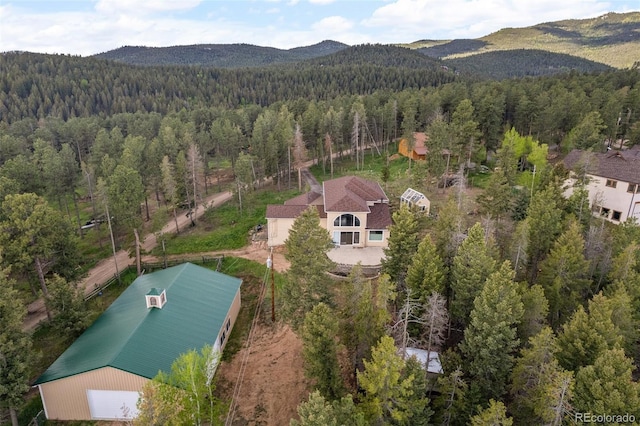 27987 Pine Grove Trl, Conifer, CO 80433 - aerial view of property and surrounding area with a heavily wooded area and a mountainous background