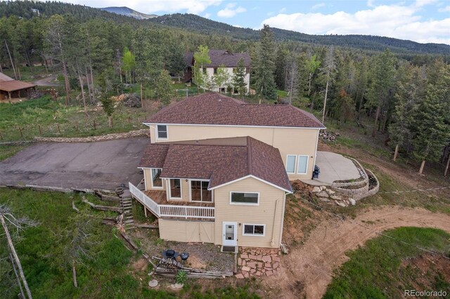 27987 Pine Grove Trl, Conifer, CO 80433 - view from above of property with a heavily wooded area and a mountainous background