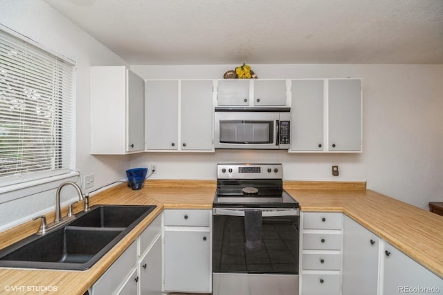 8654 Decatur St Unit 251, Westminster, CO 80031 - kitchen with appliances with stainless steel finishes, a sink, and light countertops