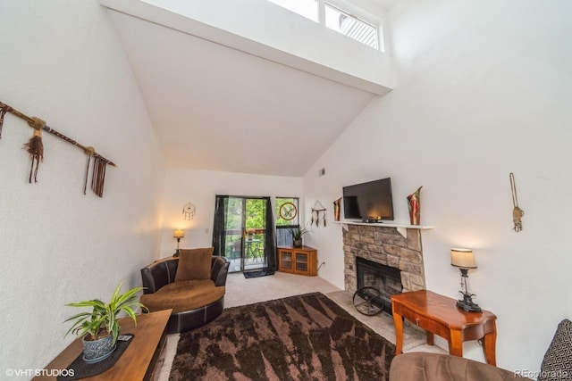 8654 Decatur St Unit 251, Westminster, CO 80031 - carpeted living area featuring high vaulted ceiling and a stone fireplace
