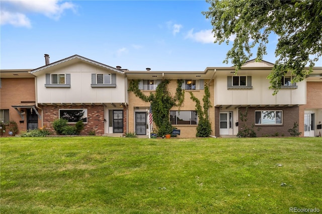 12522 W Virginia Ave, Lakewood, CO 80228 - colonial home with brick siding and a front yard