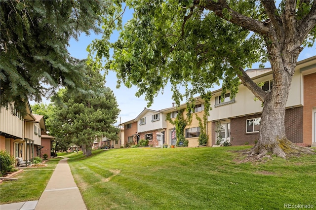 12522 W Virginia Ave, Lakewood, CO 80228 - view of property's community with a residential view and a lawn