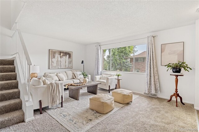 12522 W Virginia Ave, Lakewood, CO 80228 - living room with stairs, a textured ceiling, and carpet