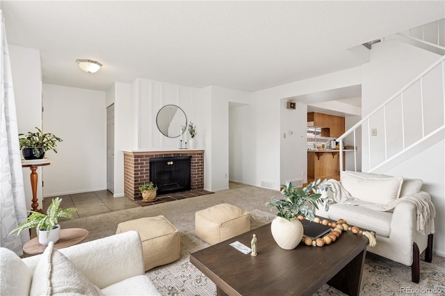 12522 W Virginia Ave, Lakewood, CO 80228 - living room featuring stairway and a brick fireplace
