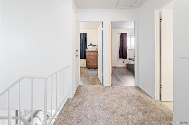 12522 W Virginia Ave, Lakewood, CO 80228 - hall featuring carpet, wood finished floors, and attic access