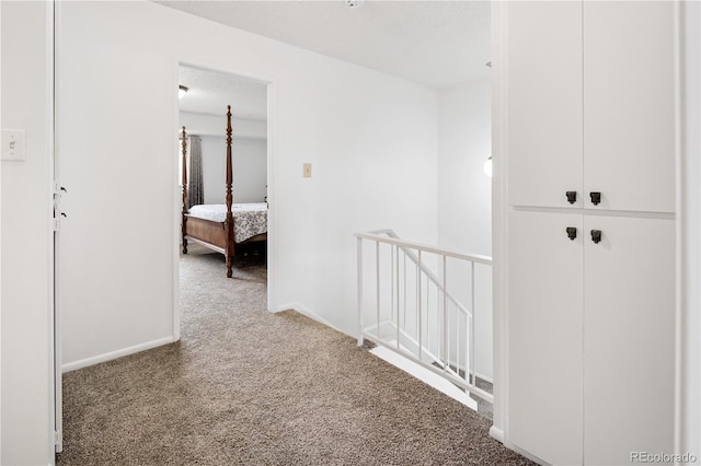 12522 W Virginia Ave, Lakewood, CO 80228 - corridor featuring an upstairs landing and carpet