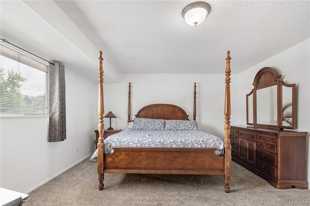 12522 W Virginia Ave, Lakewood, CO 80228 - bedroom featuring light colored carpet and a textured ceiling