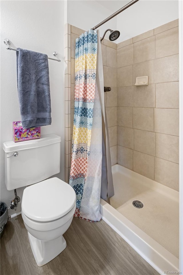 12522 W Virginia Ave, Lakewood, CO 80228 - full bathroom featuring wood finished floors and a shower stall