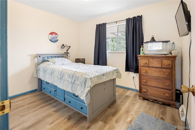 12522 W Virginia Ave, Lakewood, CO 80228 - bedroom with light wood-type flooring and baseboards