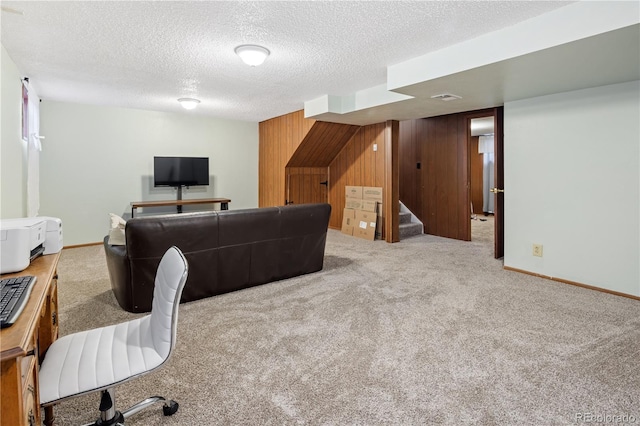 12522 W Virginia Ave, Lakewood, CO 80228 - carpeted living room featuring wooden walls, stairway, and a textured ceiling