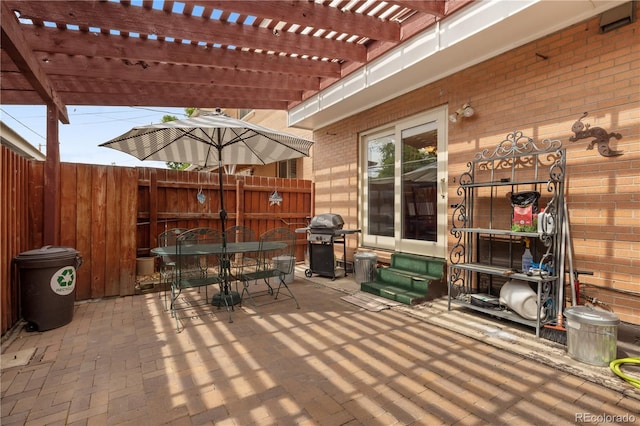 12522 W Virginia Ave, Lakewood, CO 80228 - view of patio / terrace featuring entry steps, a grill, outdoor dining space, and a pergola