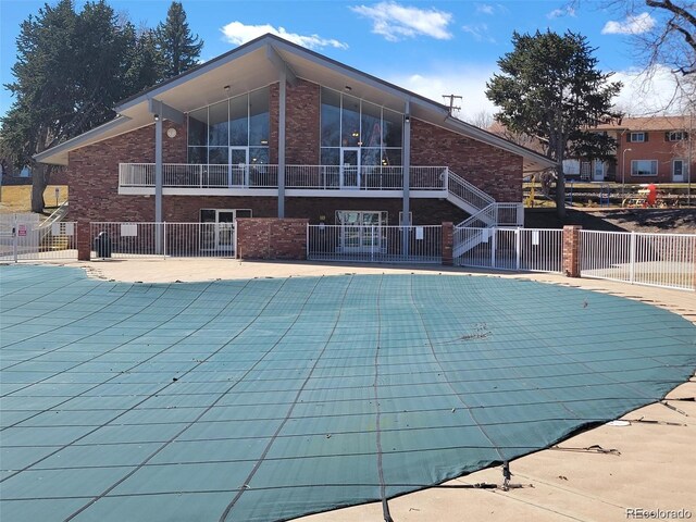 12522 W Virginia Ave, Lakewood, CO 80228 - view of swimming pool with a patio area