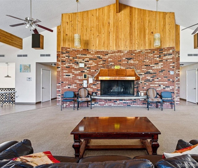 12522 W Virginia Ave, Lakewood, CO 80228 - living area with high vaulted ceiling, carpet, ceiling fan, wooden walls, and a textured ceiling