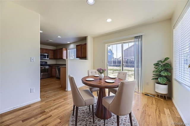 25792 E Cedar Pl, Aurora, CO 80018 - dining room with light wood finished floors and recessed lighting