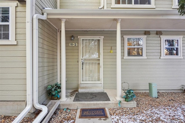 1818 S Quebec Way Unit 11-3, Denver, CO 80231 - property entrance featuring a porch