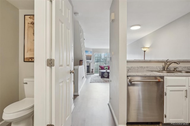 1818 S Quebec Way Unit 11-3, Denver, CO 80231 - corridor featuring a sink and wood finished floors