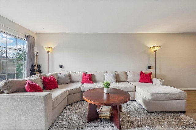 1818 S Quebec Way Unit 11-3, Denver, CO 80231 - living room featuring wood finished floors and baseboards