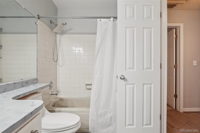 1818 S Quebec Way Unit 11-3, Denver, CO 80231 - bathroom with vanity, shower / bath combo, wood finished floors, and toilet