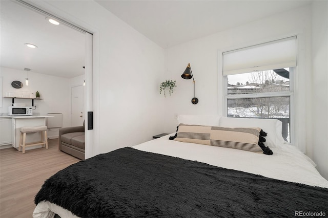 bedroom featuring light hardwood / wood-style floors