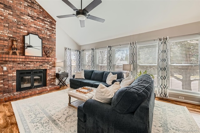 17509 E Kenyon Dr, Aurora, CO 80013 - living area with ceiling fan, a brick fireplace, high vaulted ceiling, plenty of natural light, and wood finished floors