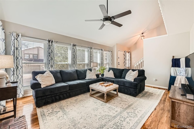 17509 E Kenyon Dr, Aurora, CO 80013 - living area with vaulted ceiling, plenty of natural light, ceiling fan, wood finished floors, and stairway