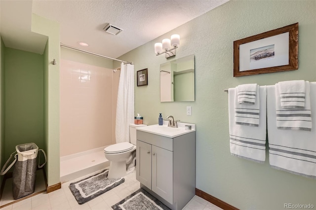 17509 E Kenyon Dr, Aurora, CO 80013 - full bathroom featuring vanity, a stall shower, a textured ceiling, and tile patterned flooring