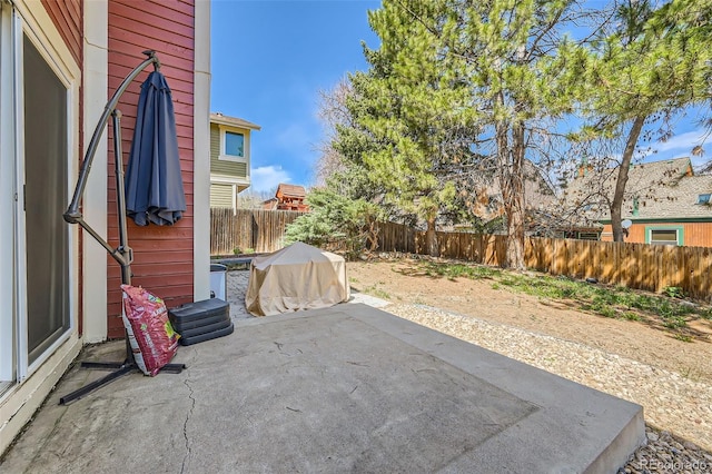 17509 E Kenyon Dr, Aurora, CO 80013 - fenced backyard with a patio area and grilling area