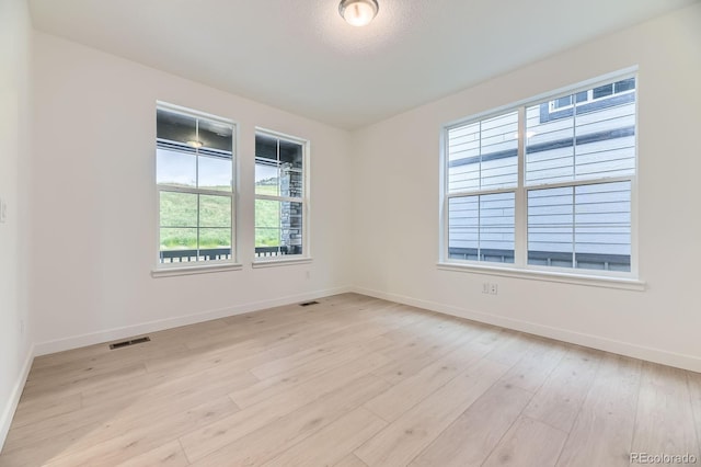 7440 S Yank Ct, Littleton, CO 80127 - unfurnished room featuring baseboards and light wood-style floors