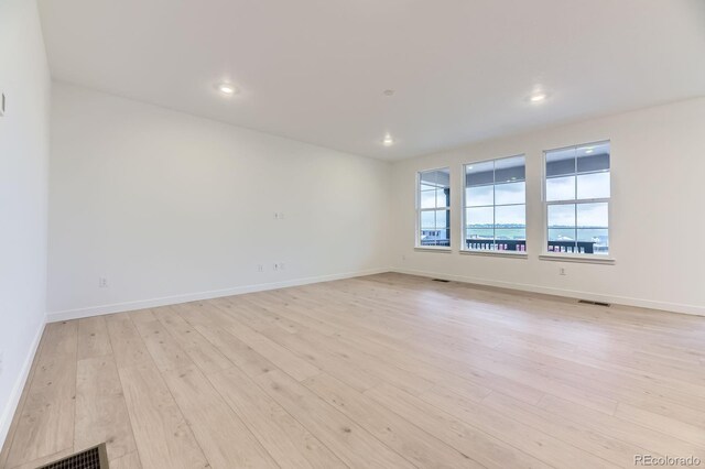 7440 S Yank Ct, Littleton, CO 80127 - spare room with light wood-style floors and recessed lighting