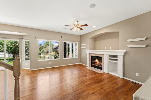 4960 Seton Pl, Colorado Springs, CO 80918 - unfurnished living room with a fireplace, wood finished floors, ceiling fan, and recessed lighting