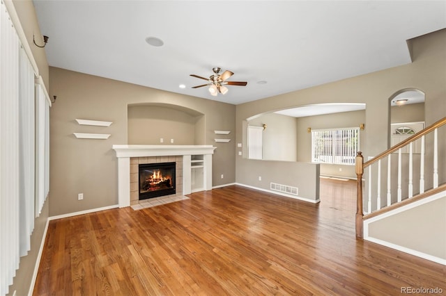 4960 Seton Pl, Colorado Springs, CO 80918 - unfurnished living room with wood finished floors, ceiling fan, a fireplace, recessed lighting, and stairway