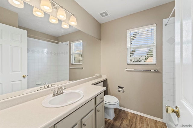 4960 Seton Pl, Colorado Springs, CO 80918 - full bathroom featuring vanity, wood finished floors, and a shower