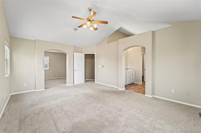 4960 Seton Pl, Colorado Springs, CO 80918 - unfurnished bedroom with arched walkways, carpet, ensuite bath, high vaulted ceiling, and a ceiling fan