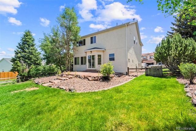 4960 Seton Pl, Colorado Springs, CO 80918 - back of property featuring stucco siding and a patio
