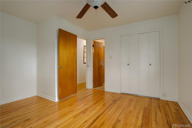 unfurnished bedroom with a ceiling fan, light wood-style floors, a closet, and baseboards