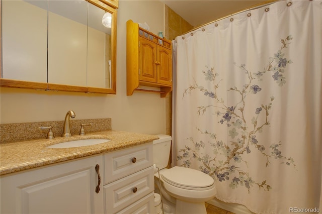 full bathroom with vanity, curtained shower, and toilet