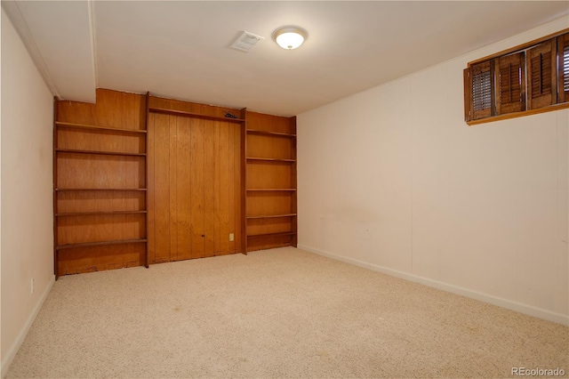 interior space featuring visible vents, baseboards, and built in features