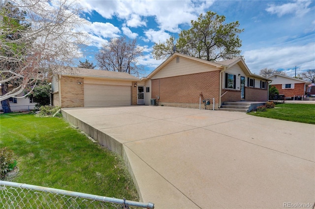 ranch-style house with brick siding, a front lawn, concrete driveway, and a garage